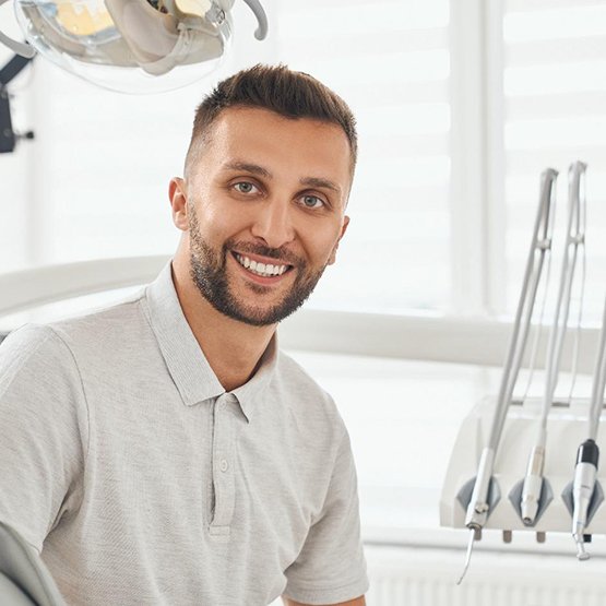 Smiling patient sitting up in treatment chair